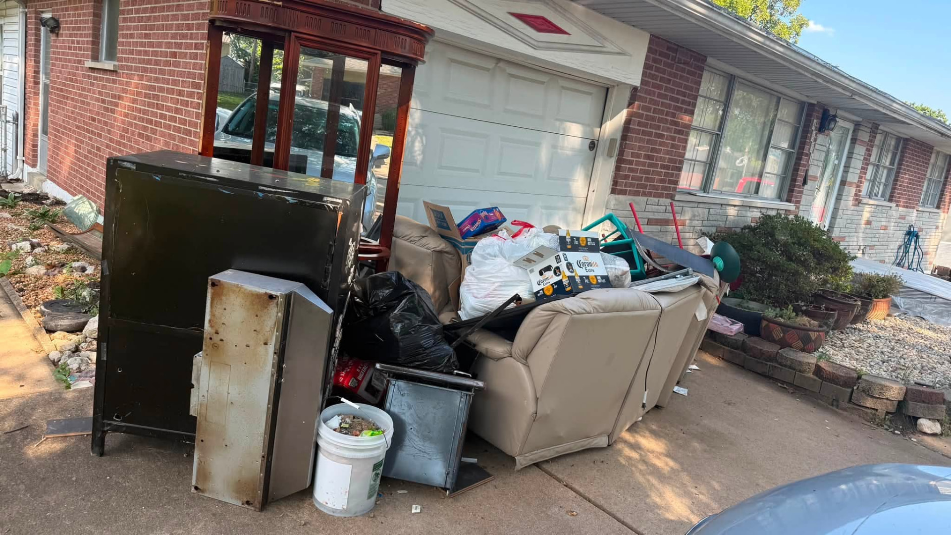 Furniture, cabinets, and household items piled for pickup